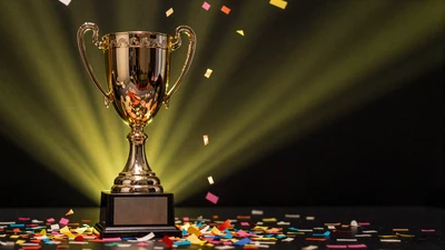 Goldene Troph&auml;e mit Konfetti im Jackpot-Bereich von Golisimo Casino